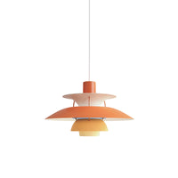 Orange layered pendant light displayed against a plain background with warm yellow accents.