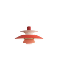 Red and pink layered pendant light displayed against a plain background with a bold modern color combination.